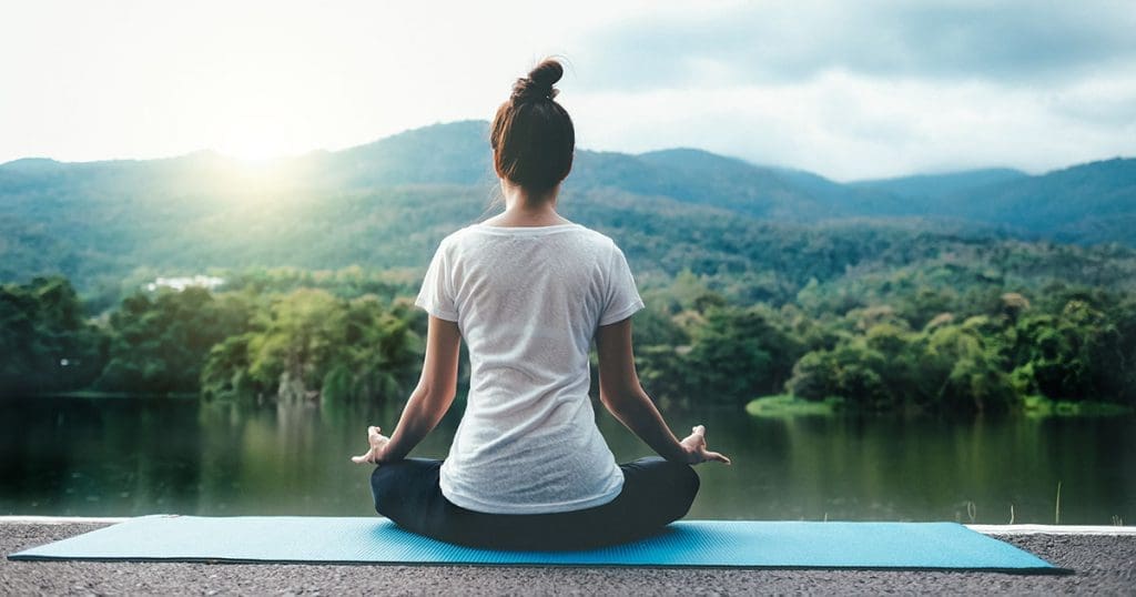 Indian TouriIndian Tourism -Young woman doing yoga in morning park for Relaxing . Wellness and Healthy Lifestyle.