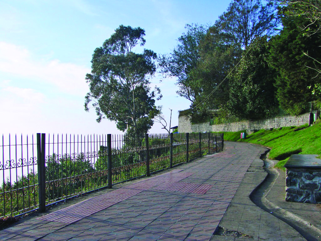 Monsoon Holiday Magic Paved path of Coakers Walk Kodaikanal