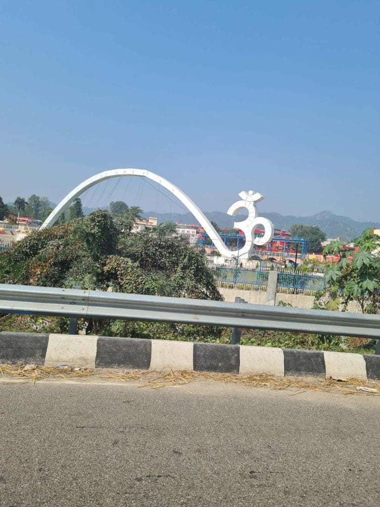 Visit Rishikesh and Haridwar 
A-giant-Om-arches-across-a-bridge-to-welcome-visitors-to-Haridwar