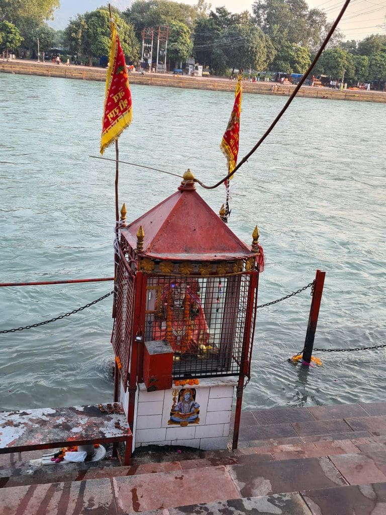 Rishikesh and Haridwar - top trips of 2022 for epic faith and spiritual calling 34 A-shrine-on-the-edge-of-the-holy-Ganga-puntuates-the-walk-along-the-Ghats-of-Haridwar