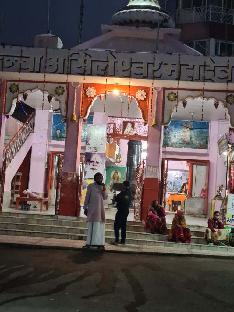 Visit Rishikesh and Haridwar  
A-temple-in-Rishikesh-with-painted-murals-and-pilgrims-sitting-in-silence
