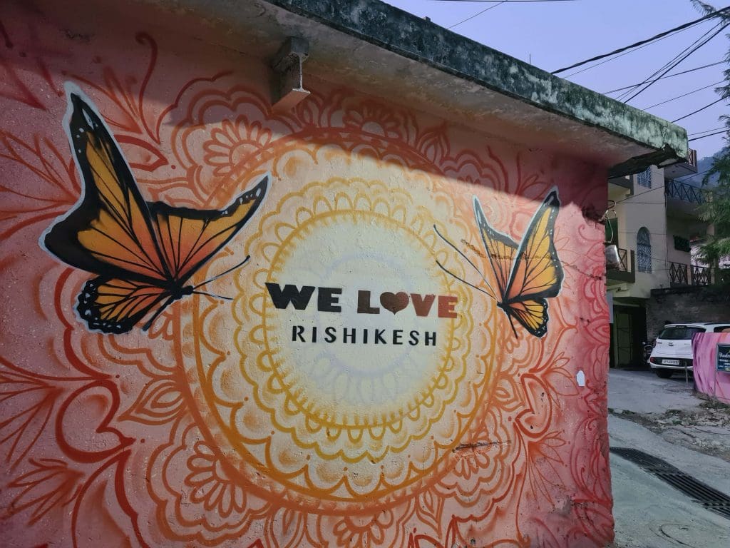 Visit Rishikesh and Haridwar  
A-wall-painting-at-a-street-corner-in-a-street-in-Rishikesh