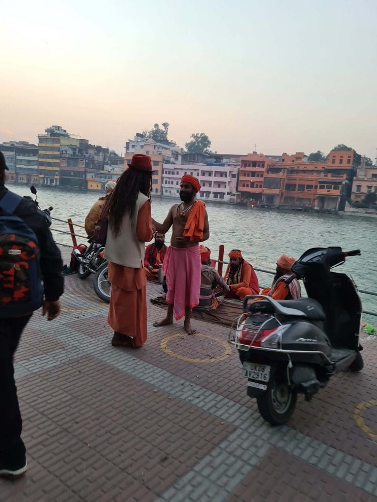 Visit Rishikesh and Haridwar 
Bike-riders-students-pilgrims-and-sadhus-chat-about-life-and-the-world-beyond-at-the-Ghats-of-Haridwar-