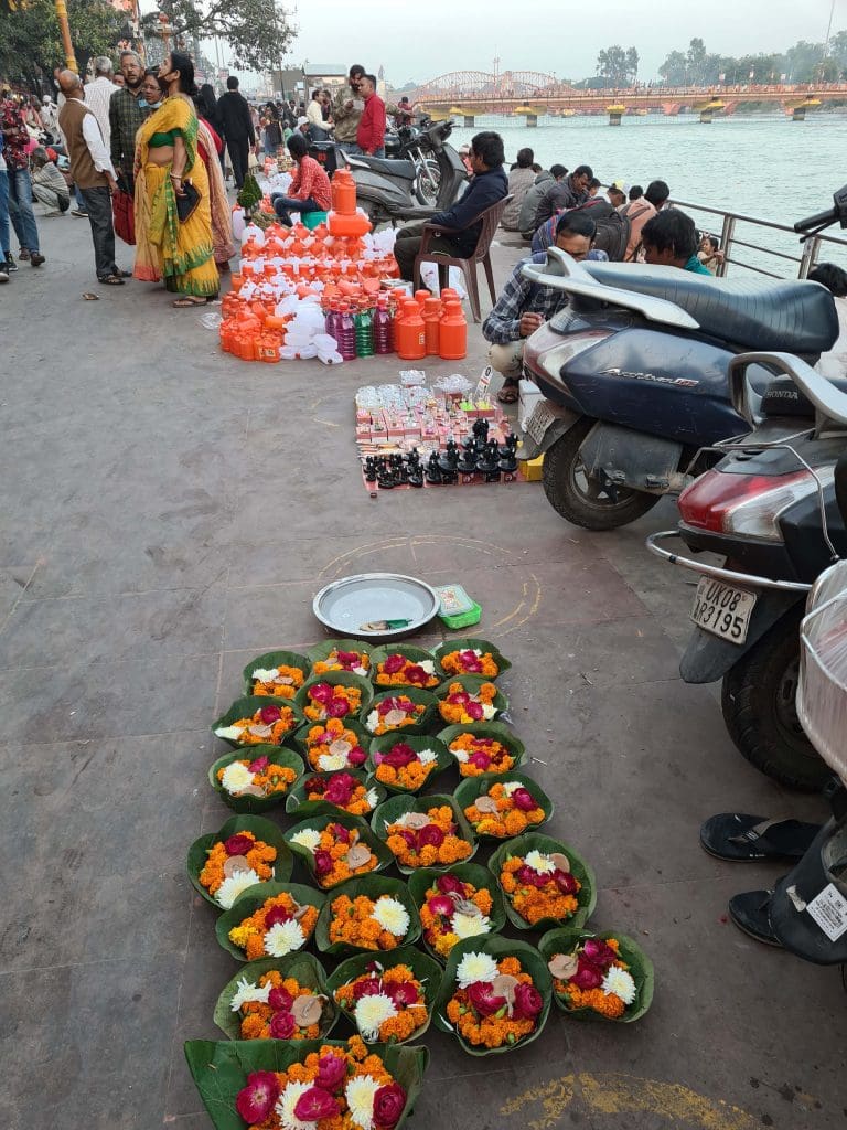 Visit Rishikesh and Haridwar 
Leafy-boats-filled-with-flowers-along-with-bottles-for-holy-water-for-pilgrims-at-the-Ghats-of-Haridwar-