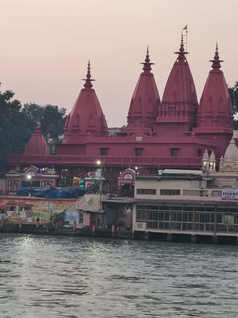 Visit Rishikesh and Haridwar 
Temples-in-deep-brick-maroon-just-before-dusk-at-Haridwars-famous-Ghats..note-the-wall-paintings-at-the-edge-of-the-water-