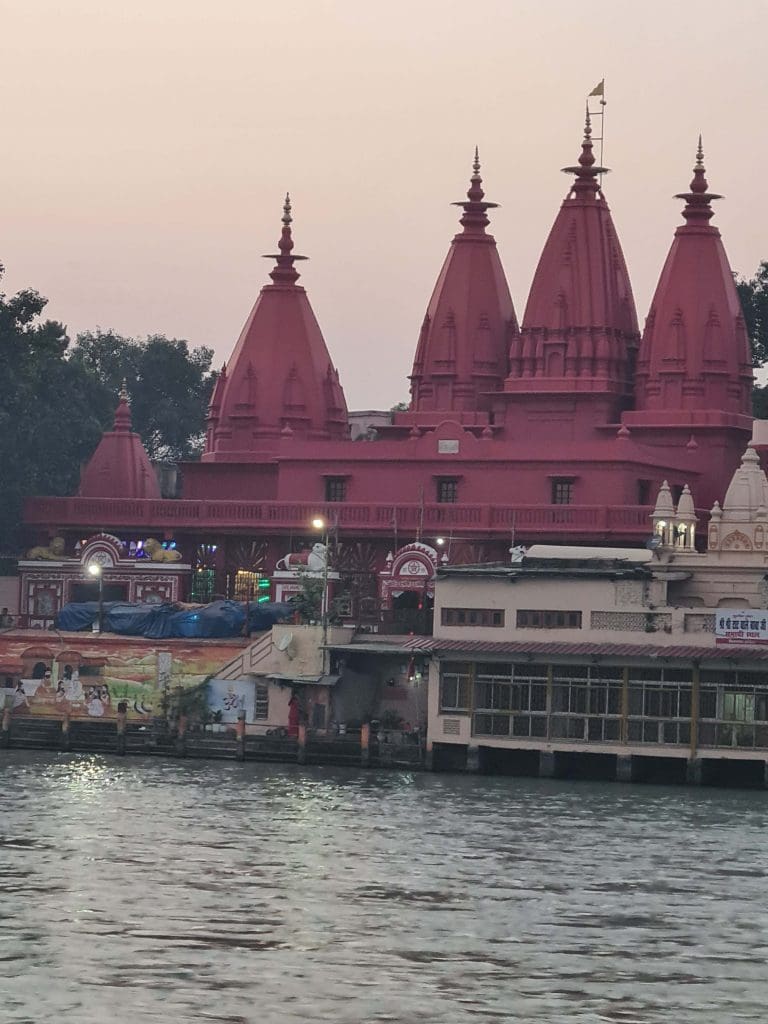 Rishikesh and Haridwar - top trips of 2022 for epic faith and spiritual calling 23 Visit Rishikesh and Haridwar
Temples-in-deep-brick-maroon-just-before-dusk-at-Haridwars-famous-Ghats..note-the-wall-paintings-at-the-edge-of-the-water-