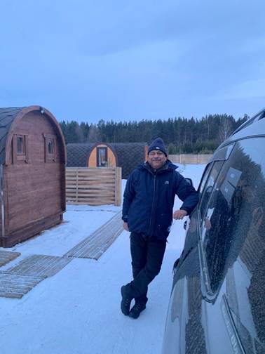 Picture 7 – Max drilling into iced lake Baikal Michaels homestay cabins 2 Amazing 12-day SUV trip over frozen Siberian Lake Baikal