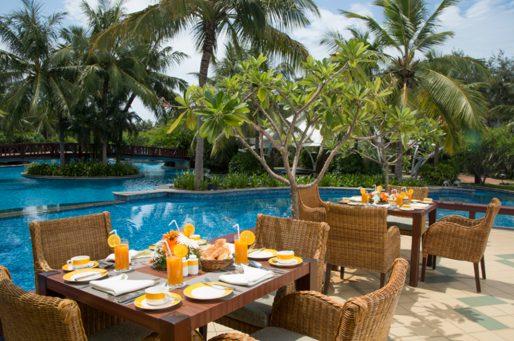 Celebrating food and unique dining experiences at these fine restaurants in India 2 Water Edge Cafe outdoors, Radisson Blu Resort Temple Bay