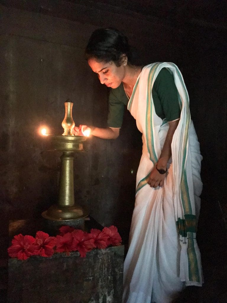 TRADITIONALLY-THE-GIRL-OF-THE-HOUSE-LIGHTS-TRADITIONAL-LAMP-AT-DUSK-AS-AN-OFFERING-OF-GRATITUDE-TO-THE-GODS