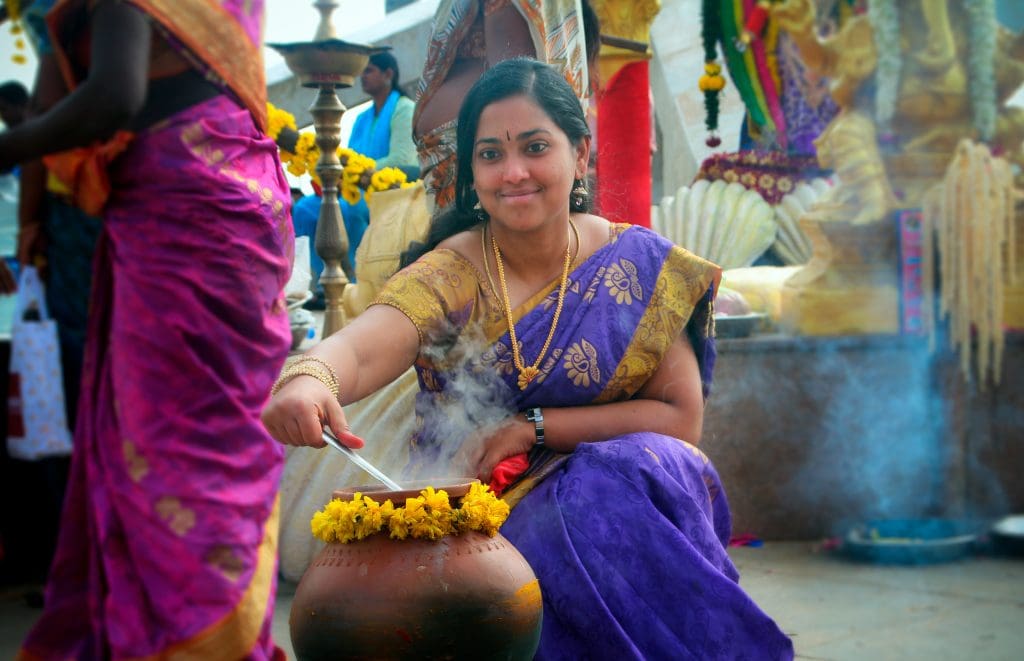 Traditional cooking of Pongal dish - Image courtesy Nithi Anand via Wikipedia Commons