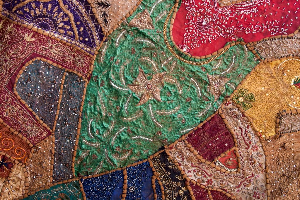 Colorful fabric artwork, ornamental patterns on textile. Kochi, Kerala. Image courtesy Vyacheslav Argenberg via Wikipedia Commons