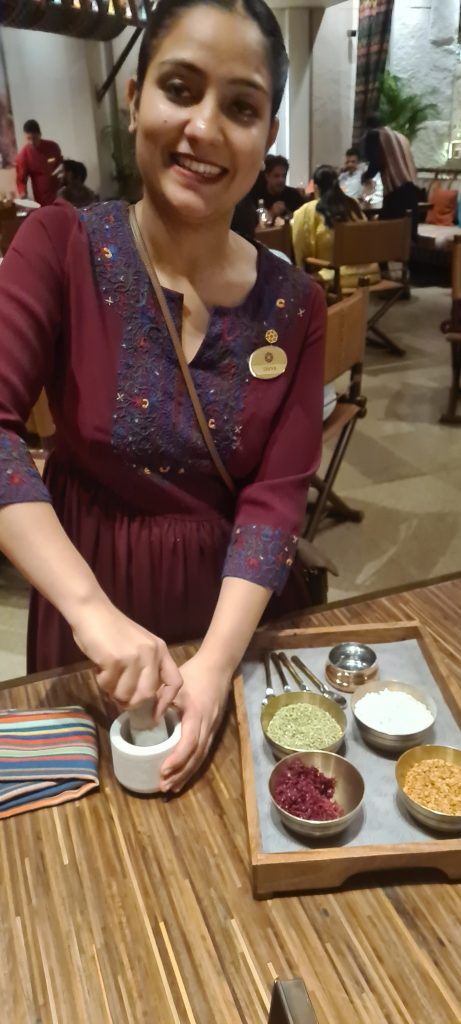 Our charming hostess Divya provides the family touch as she grinds fresh aromatic herbs at the table