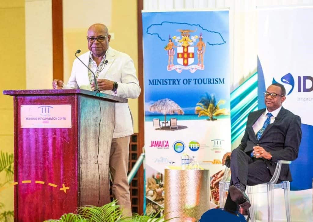 Jamaica's Government developing a robust tourism strategy 1 Minister of Tourism, Hon. Edmund Bartlett, delivers the keynote address at a Ministry of Tourism Strategy Development Workshop at the Montego Bay Convention Centre, St. James. Looking on (seated) is Director General of Technical Services, Ministry of Tourism, David Dobson. (Jamaica)