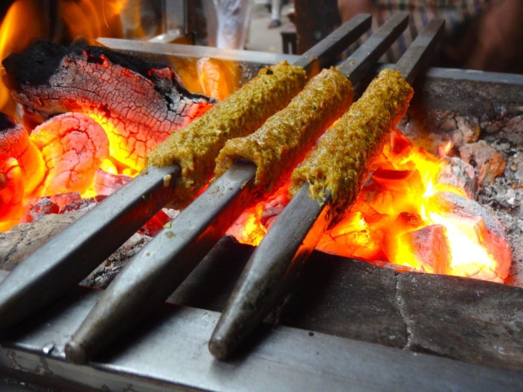 Madhya Pradesh food: Seekh Kebabs on Fire 
Image Credit: Sumitmalhotra, CC BY-SA 4.0 via Wikimedia Commons