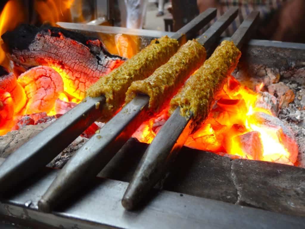 There’s more to great Madhya Pradesh food than Poha - 10 delicious dishes to try 6 Madhya Pradesh food: Seekh Kebabs on Fire
Image Credit: Sumitmalhotra, CC BY-SA 4.0 via Wikimedia Commons