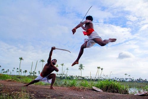 Two Kalaripayattu swordsmen demonstrating mock combat in rural Kerala. Image courtesy: Ginu C Plathottam via Wikipedia Commons
