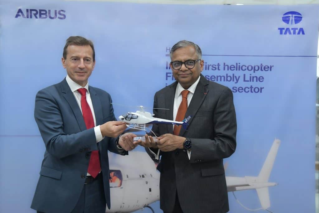 Guillaume Faury, CEO of Airbus, presenting an H125 helicopter model to N. Chandrasekaran, Chairman of Tata Sons, in New Delhi on January 26, 2024