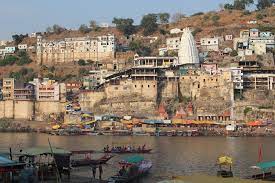 Omkareshwar is a Hindu temple dedicated to God Shiva. It is one of the 12 revered Jyotirlinga shrines of Shiva.  Image courtesy:  Arian Zwegers  via Flickr