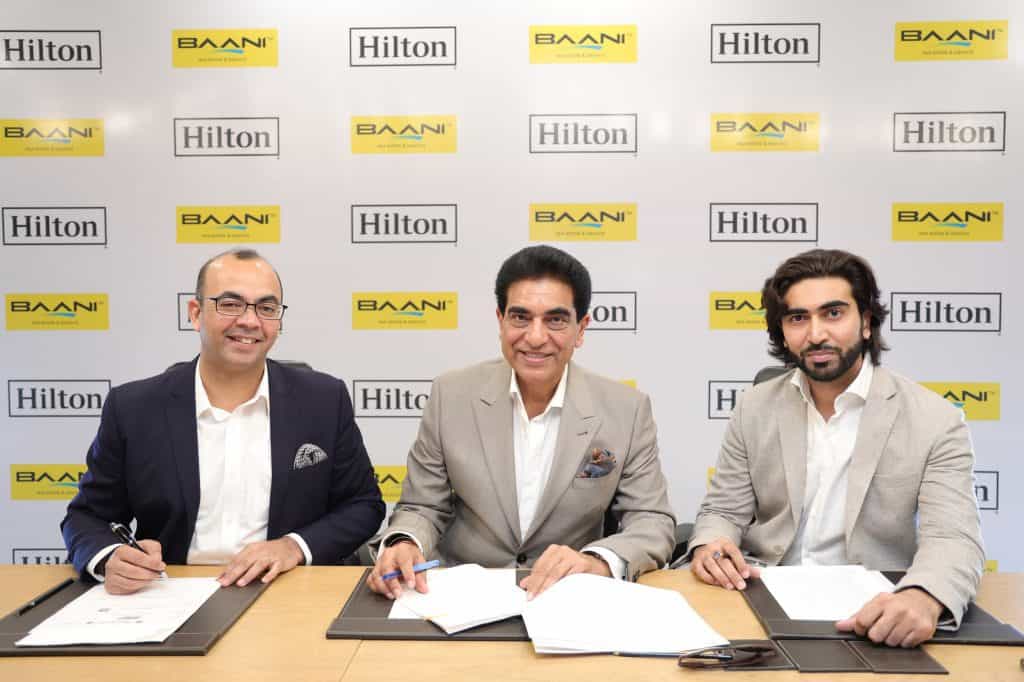 Hilton announces the signing of its flagship brand, Hilton Hotels & Resorts, in Gurugram 1 From LtoR Zubin Saxena senior VP and country head India Hilton Virendra K Bhatia Chairman Baani Group Saahil Bhatia MD Baani Group Hilton announces the signing of its flagship brand, Hilton Hotels & Resorts, in Gurugram