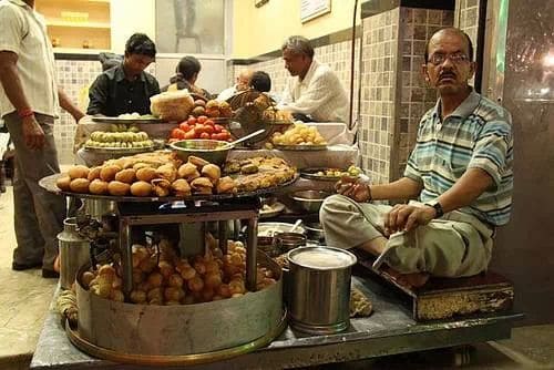 Chaat is Indian Street Food That Speaks with 15 Spices - all in one delicious bite! 8 Chaat is Indian street food at its spicy tangy best: Deena chat bhandar in Varanasi, India courtesy :Vivekdidwania1976 via Wikimedia Commons