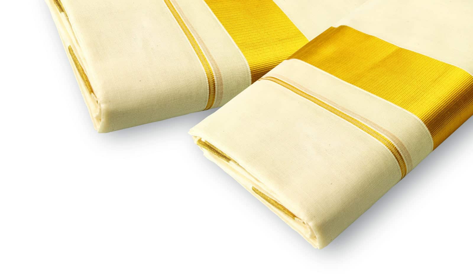 The traditional set-mundu, which is the women’s wear during Onam festivities. A pair of off-white cloth-pieces, one will go round the waist while the other slings above the left shoulder to dangle down like a sari. The set-mundu borders come in different colours and embroidered designs, but the most classical of them is the golden brocade called Kasavu.