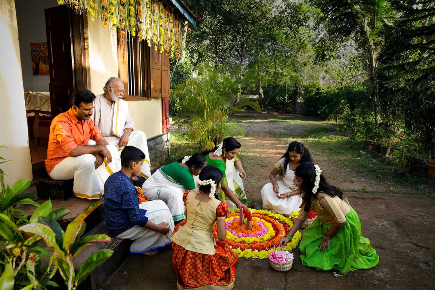 In Onam the Pookalam is a roundish flower-carpet, typically arranged by the children and women on the front yard of their house