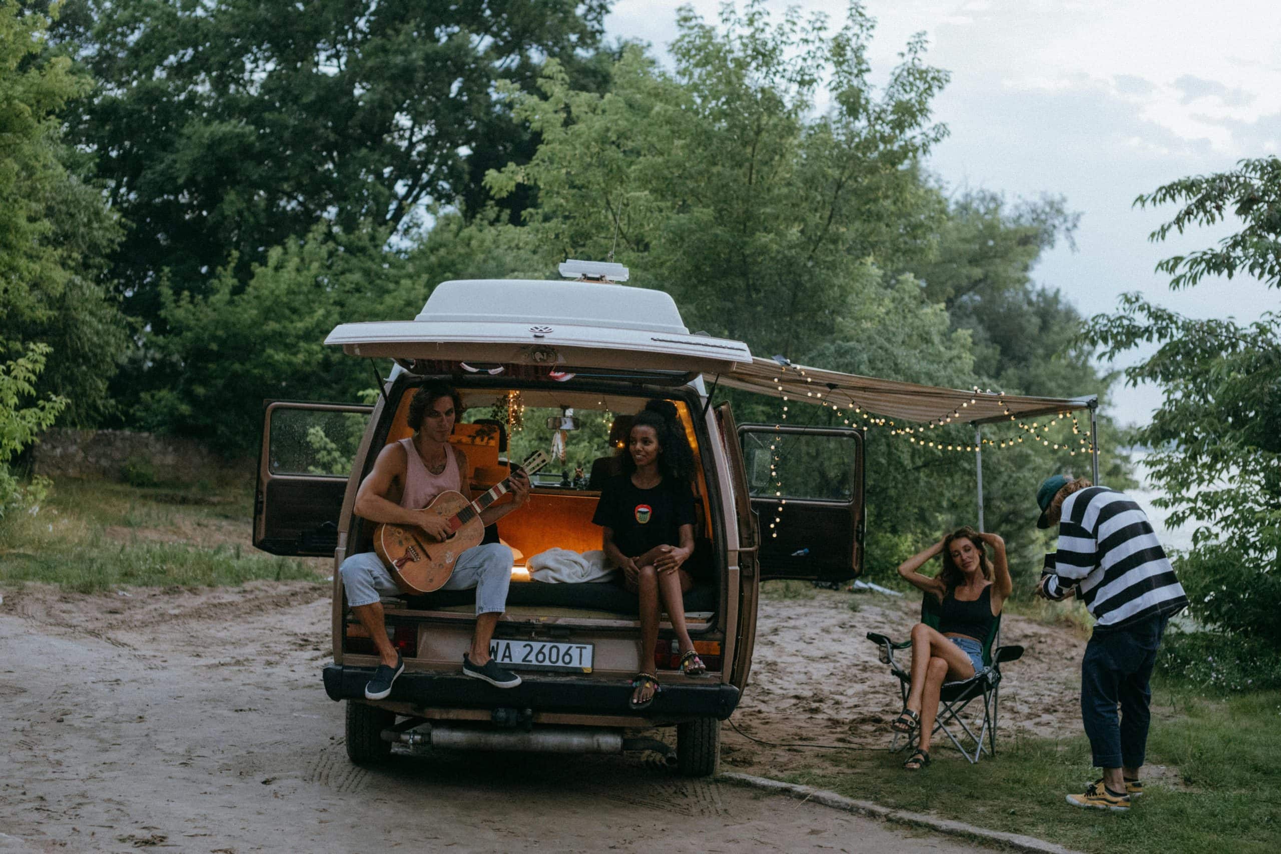 Wanderlust in motion — friends on a road trip, music playing, laughter echoing, and memories unfolding under open skies. Courtesy: KoolShooters, Pexels