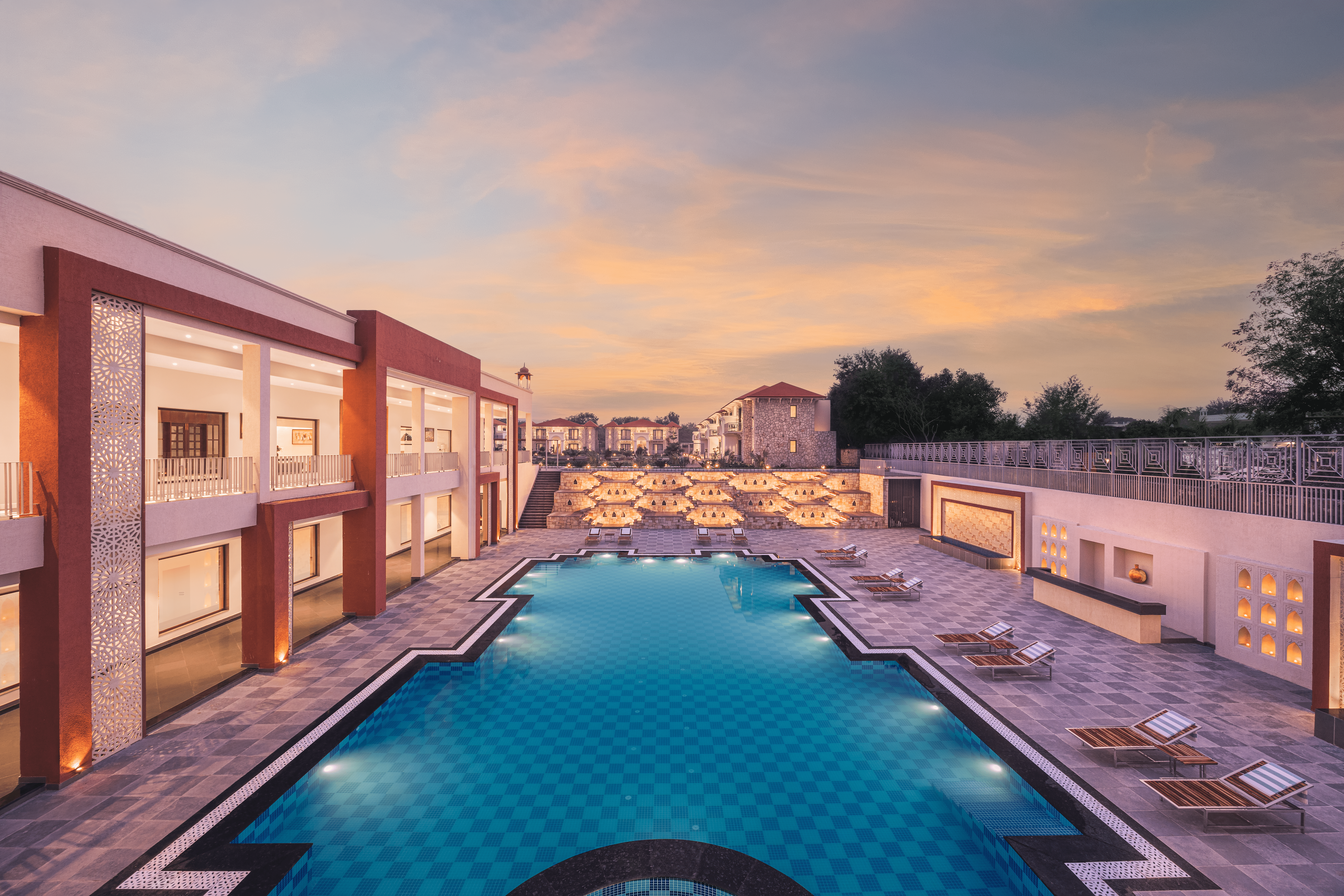 Olympic size pool with outdoor dining options at Bookmark Resorts, Jogi Mahal, Ranthambore
