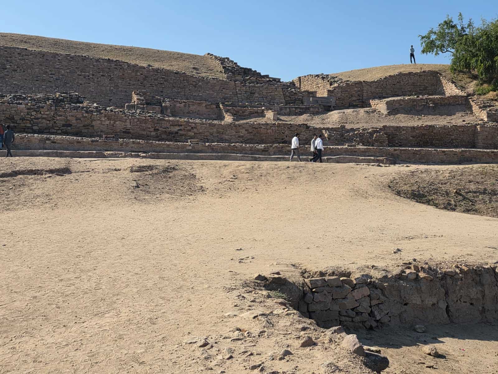 Walking through the layered stone remains of Dholavira’s citadel.
