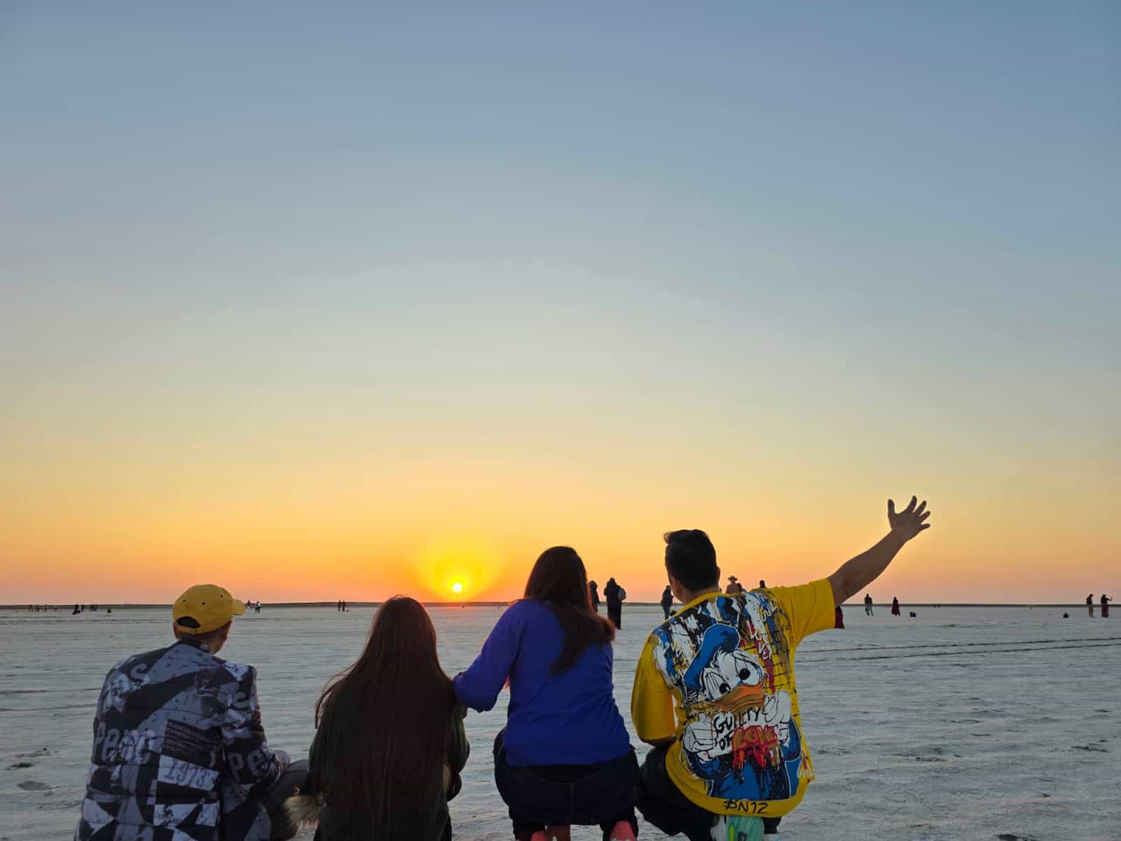 Watching the sun dip into the white horizon, the Rann turns into a shared moment of quiet joy.