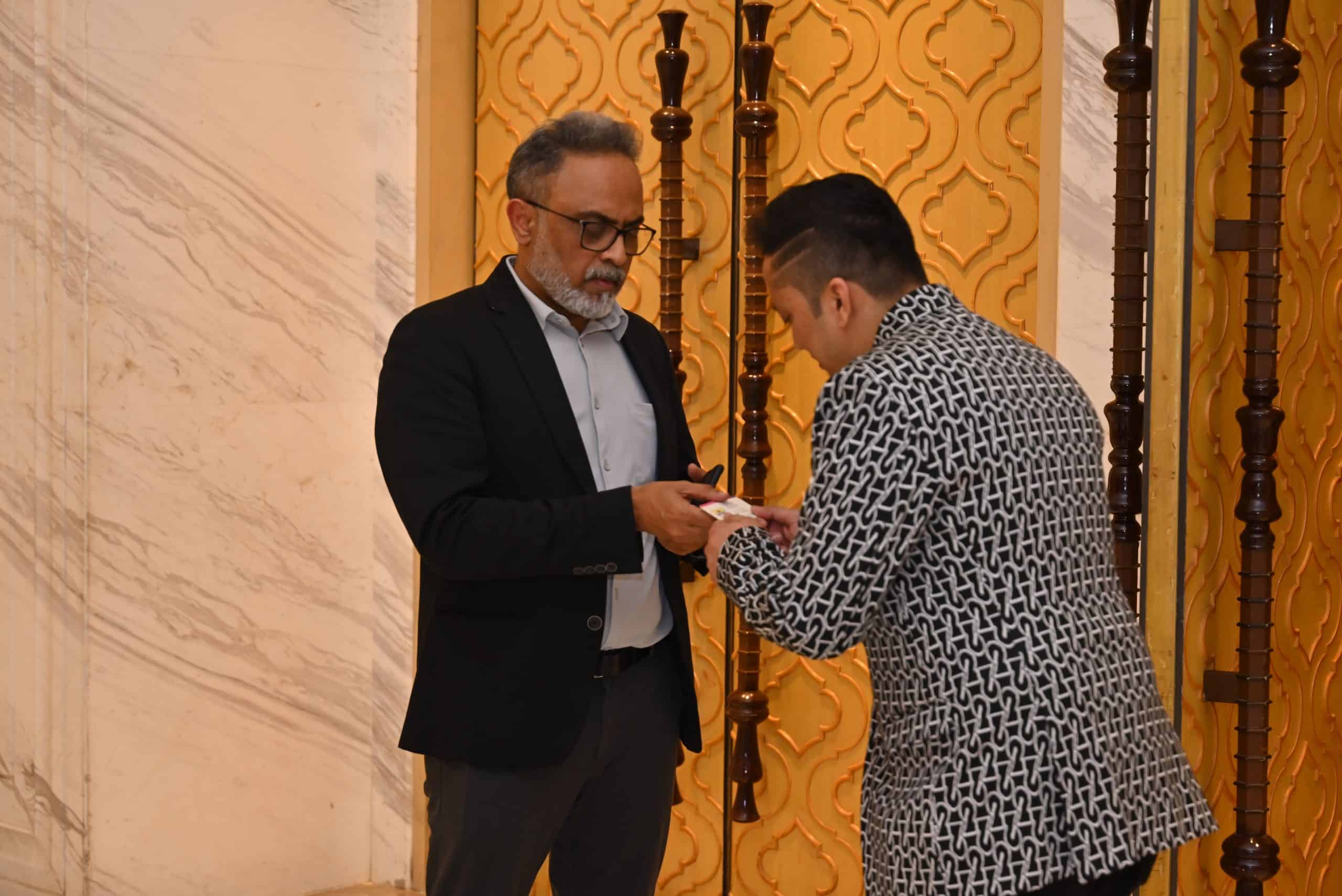 Delegates connect during the South African Tourism Think Tank in Kolkata, exchanging business cards