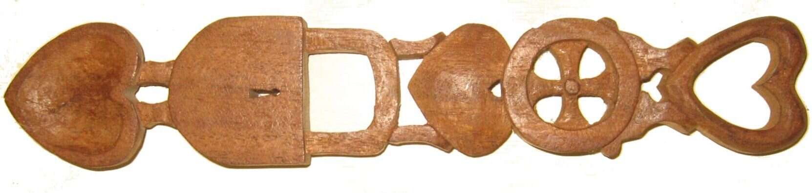 A wlsh Lovespoon with heart, lock and wheel. Iamge Courtesy: Jongleur via Wikimedia Commons