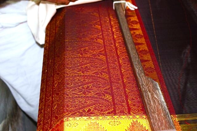 Silk saree inn the making in Kanchipuram. Image courtesy: Kamal Venkit via Wikipedia Commons