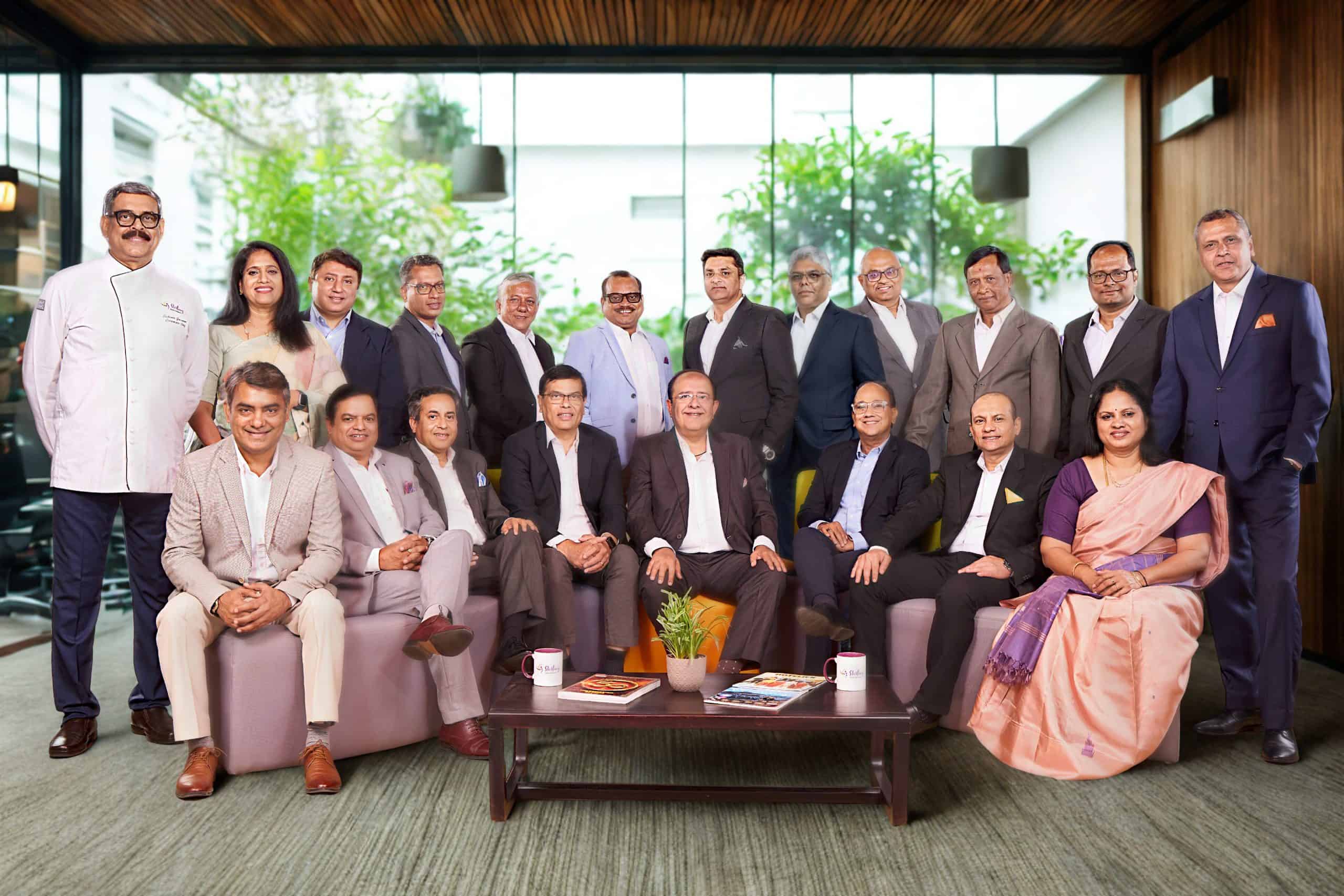 Vikram Lalvani Flanked by His Leadership Team