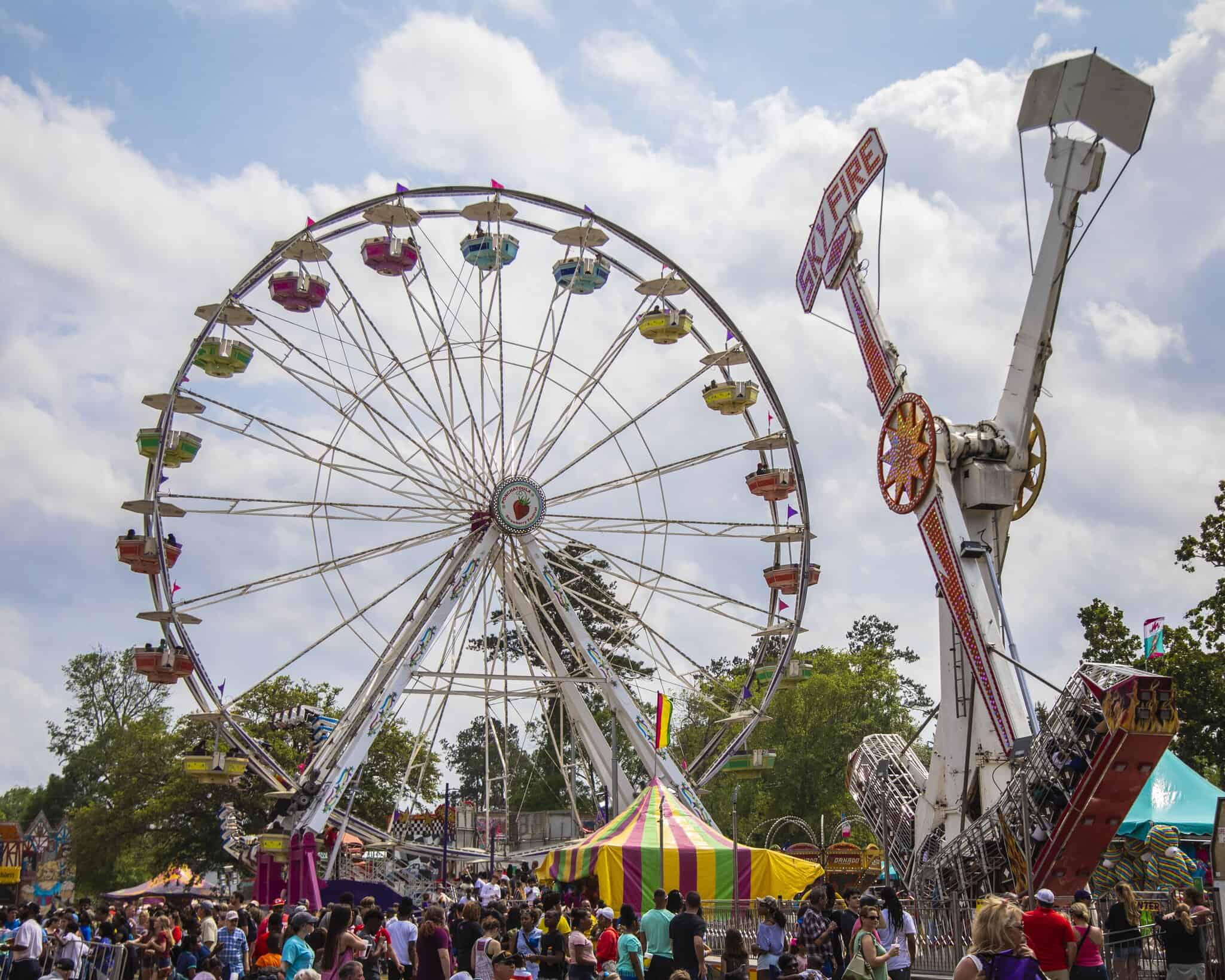 Ferris wheels, fairground rides and colourful tents set the scene for a lively day of celebration