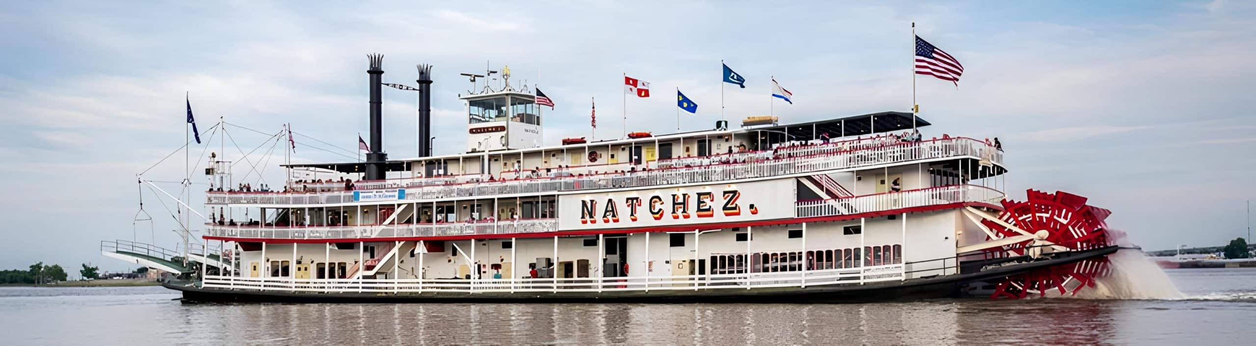 The Steamboat Natchez cruises the Mississippi River with classic New Orleans jazz and old-world riverboat charm