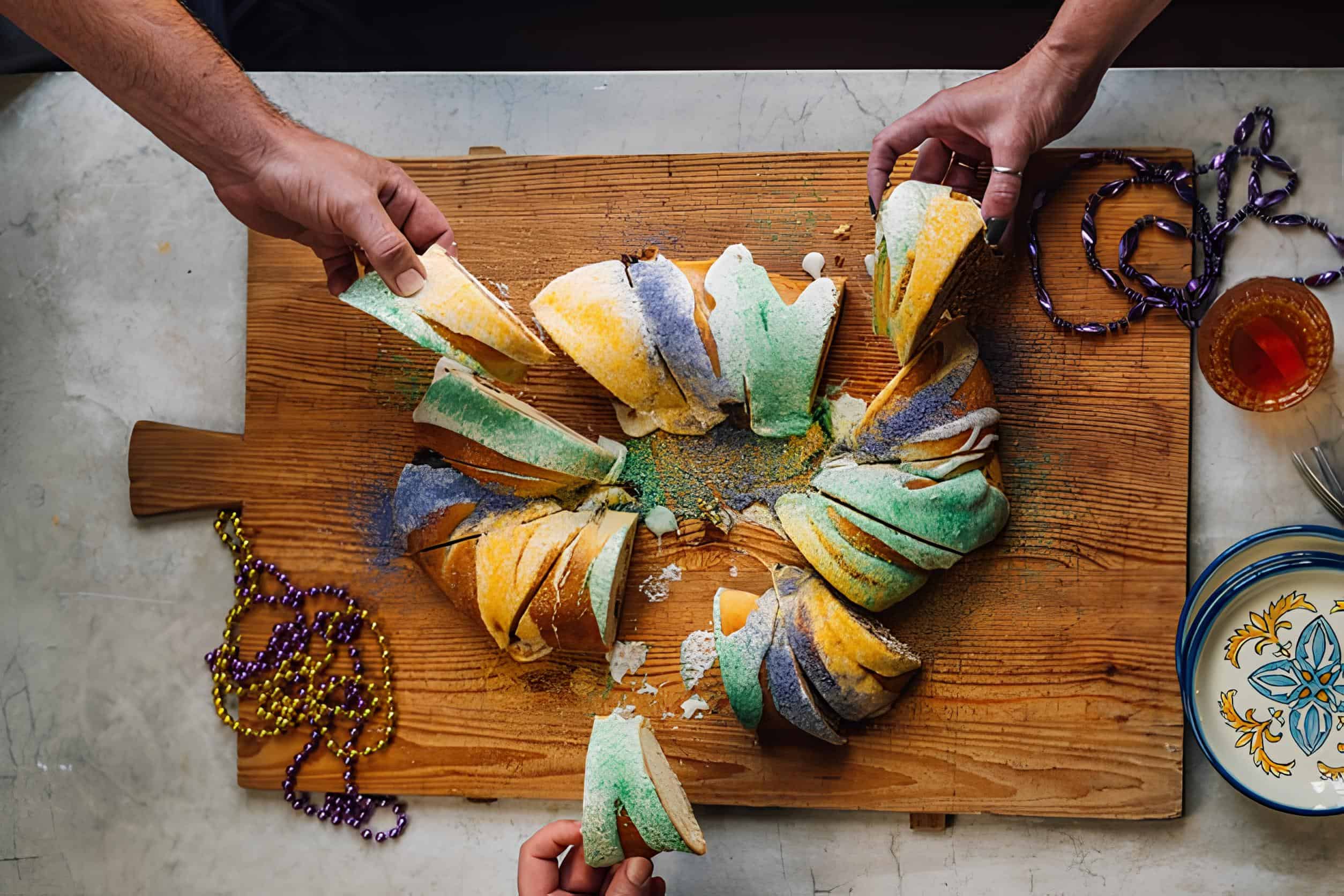 A Mardi Gras King Cake, bright with purple, green, and gold sugar, celebrates Louisiana’s festive season.
