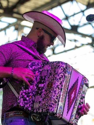 A Zydeco musician brings Louisiana’s vibrant rhythm and Creole spirit alive on stage