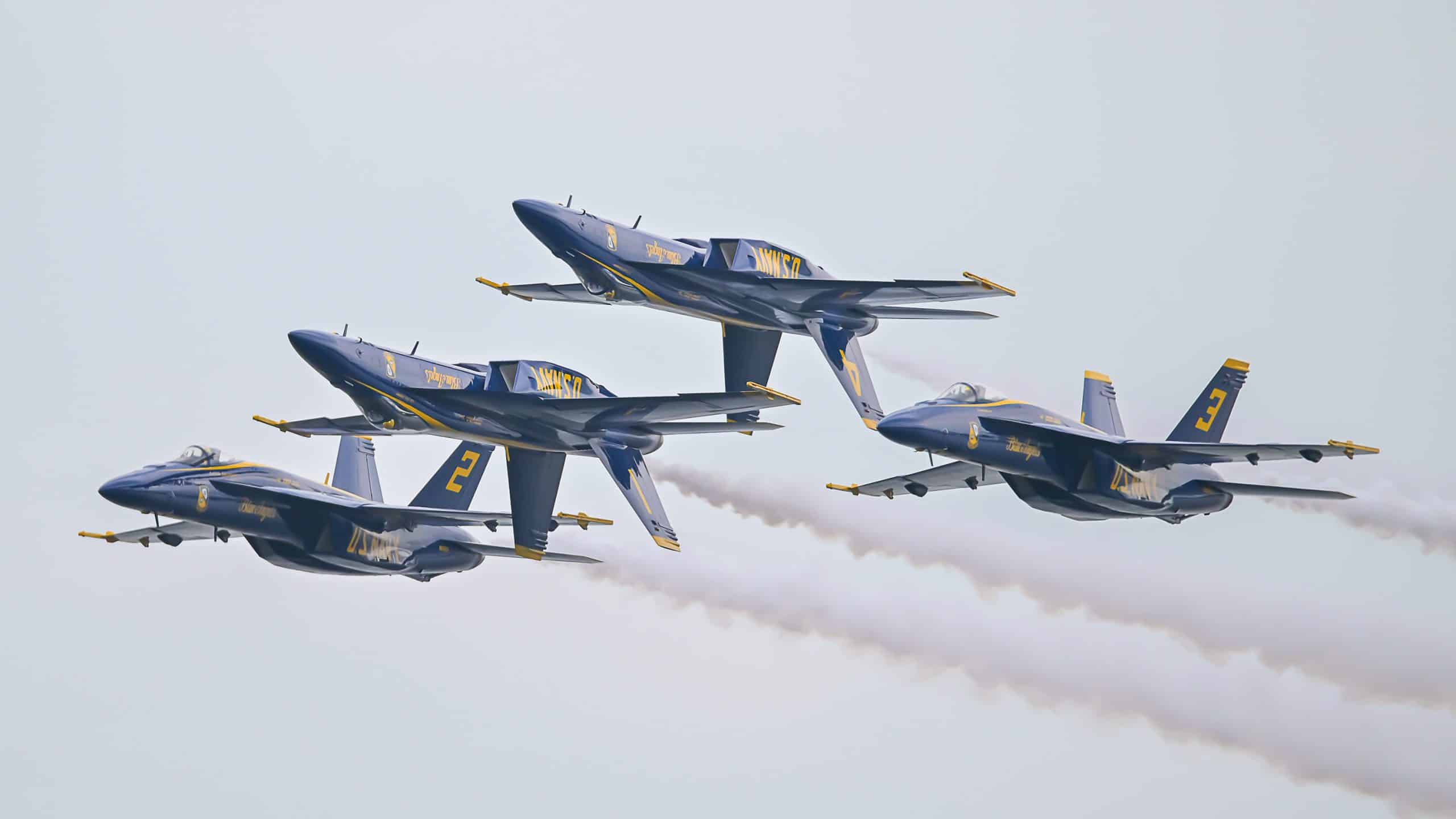 Blue Angels jets cut across the sky in a thrilling festival air show.
