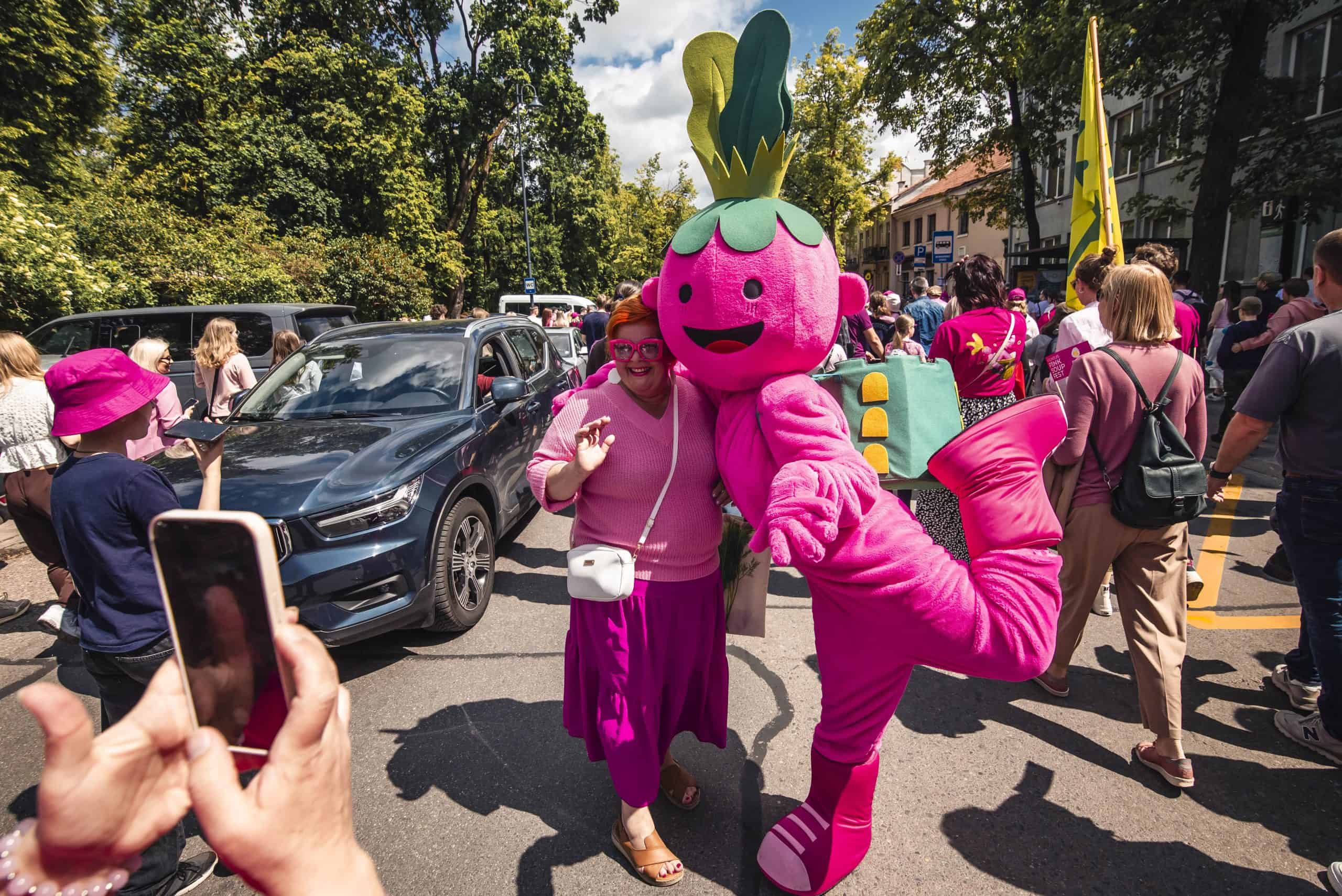 estival crowds turn the streets into a sea of pink as the playful mascot steals the spotlight