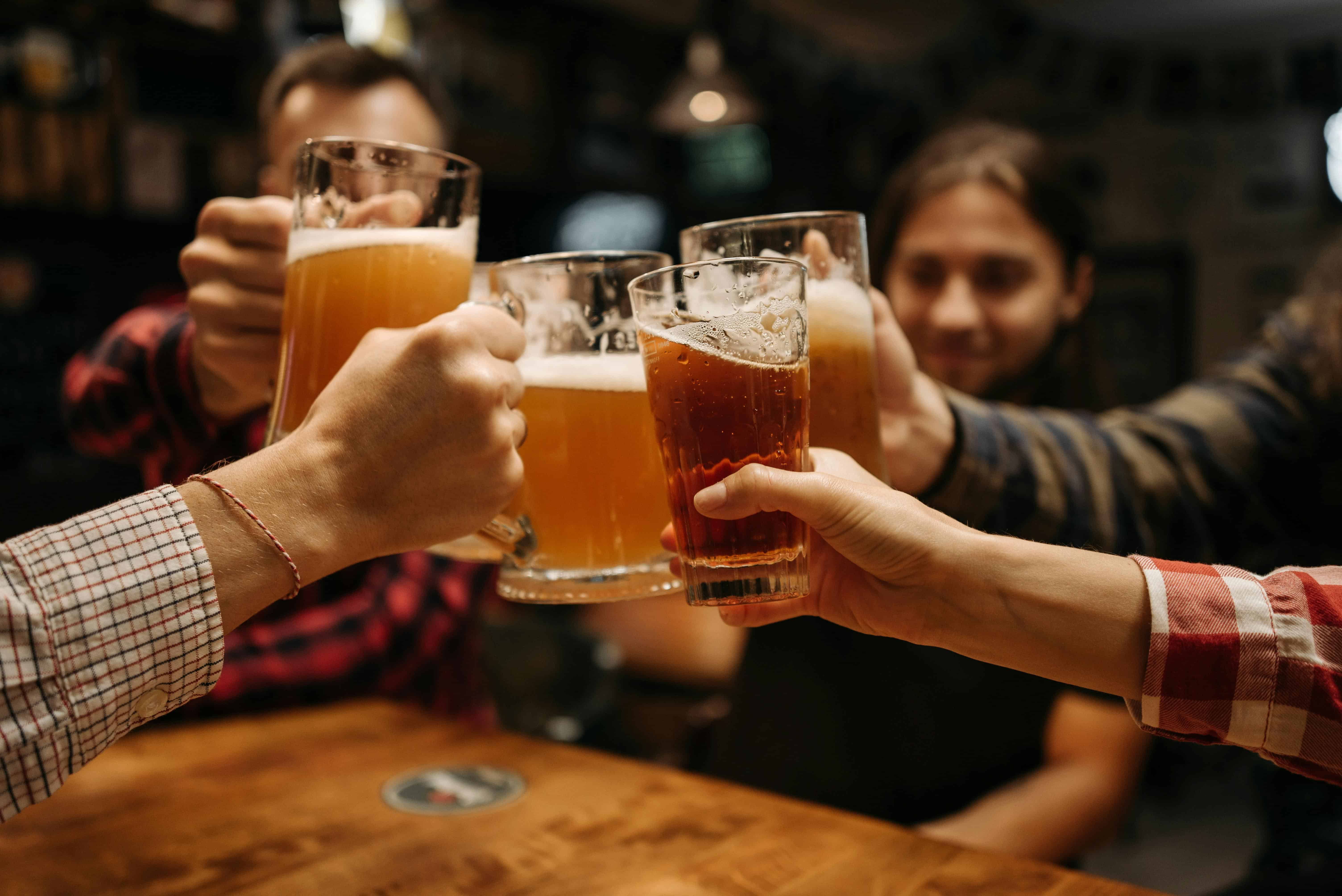 Celebratory toast with beer mugs. Courtesy: pexels, Pavel danilyuk