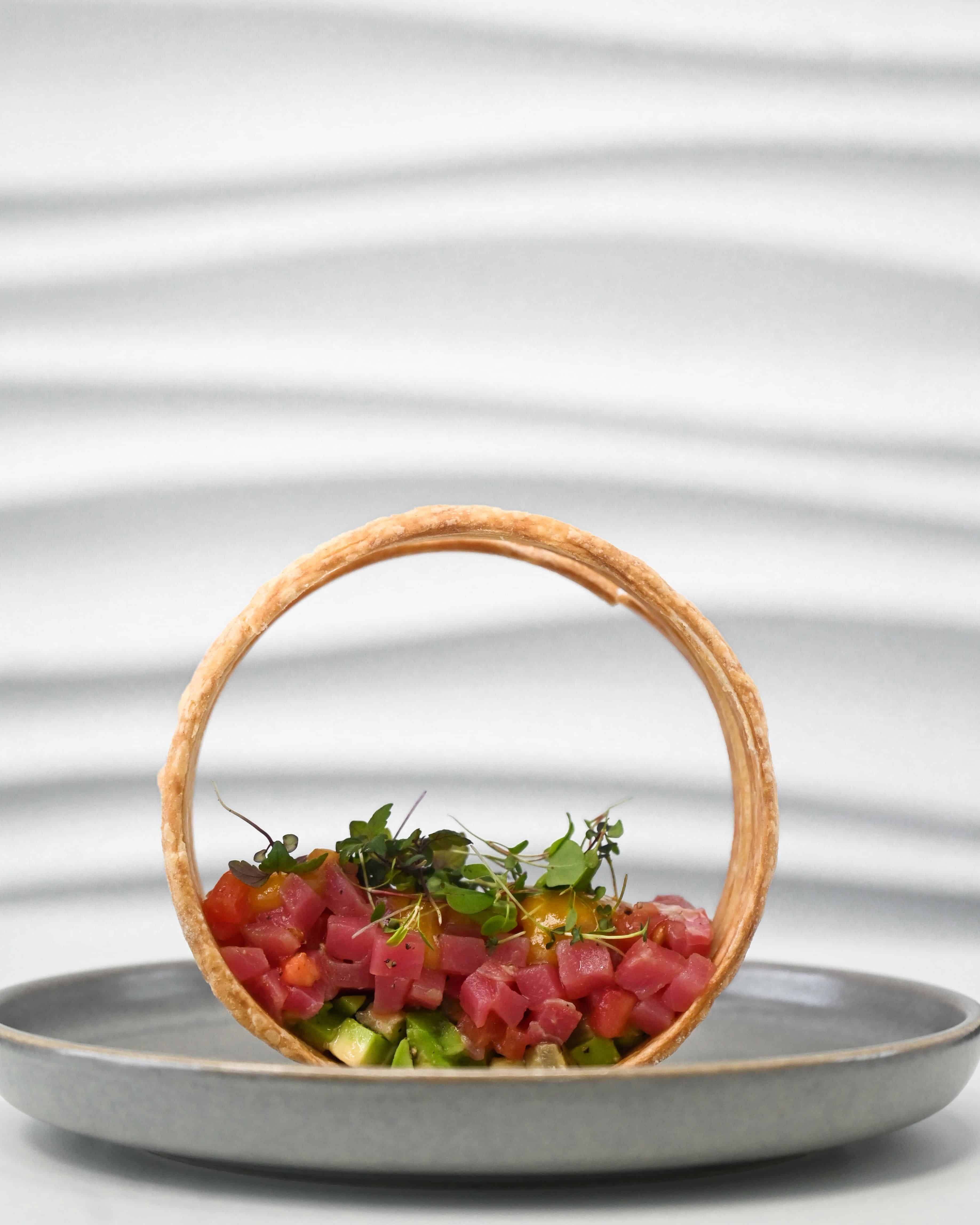 Elegant tuna tartare dish with a pastry ring. Courtesy: ganinph, pexels-