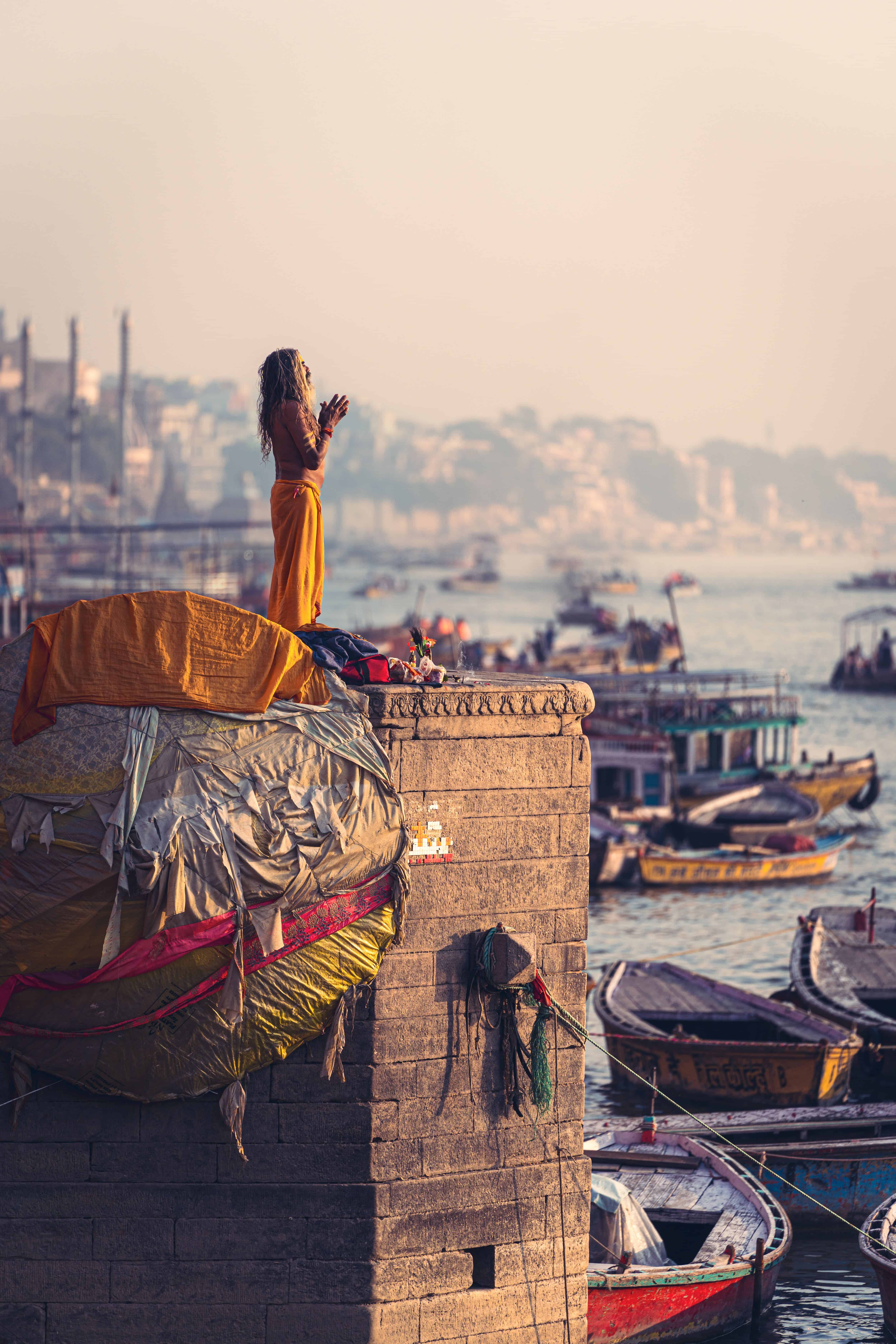 A person performs a morning ritual on Varanasi Ghat. Image Courtesy: Dmitry Voronov, Pexels