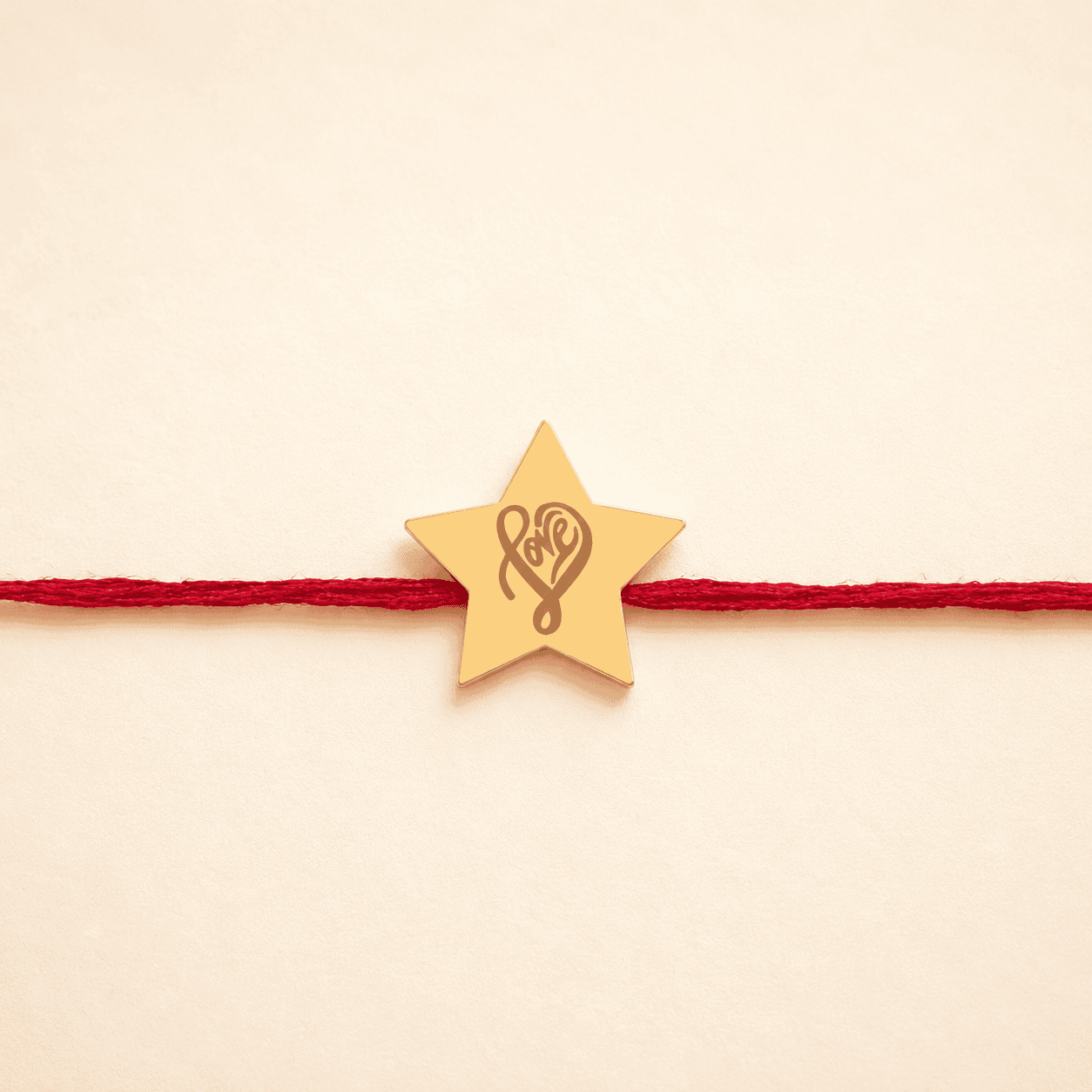 AuGrav Love and Star Golden Rakhi can be personalised, giving a small gold rakhi a much stronger emotional connection