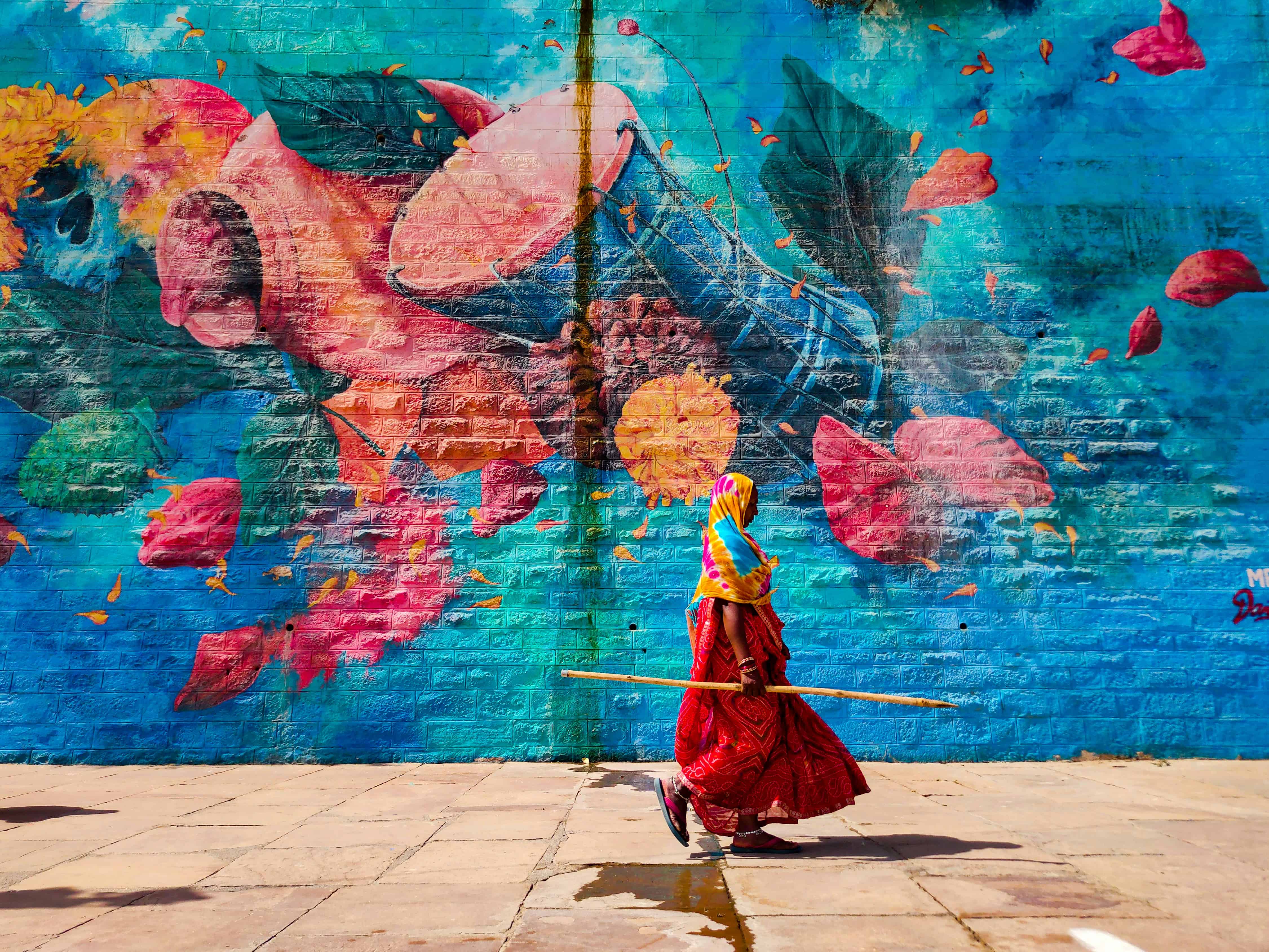 One of the best ways to experience Varanasi is through the city's painted walls. Image Courtesy: Arka Dutta, Unsplash