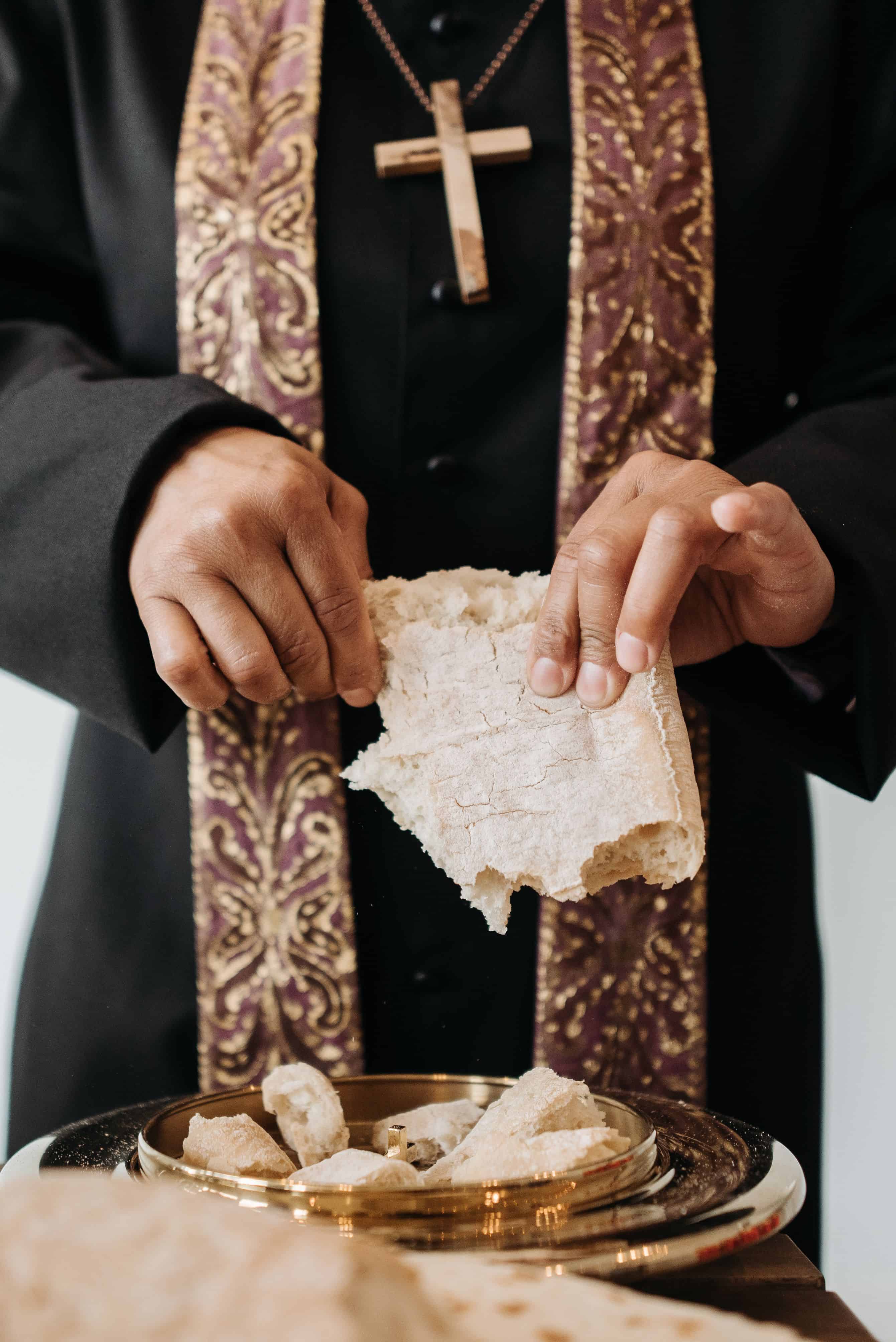 The Eucharist is the sacrament in which consecrated bread and wine become the Body and Blood of Christ. Image courtesy: Pavel Danilyuk, Pexels