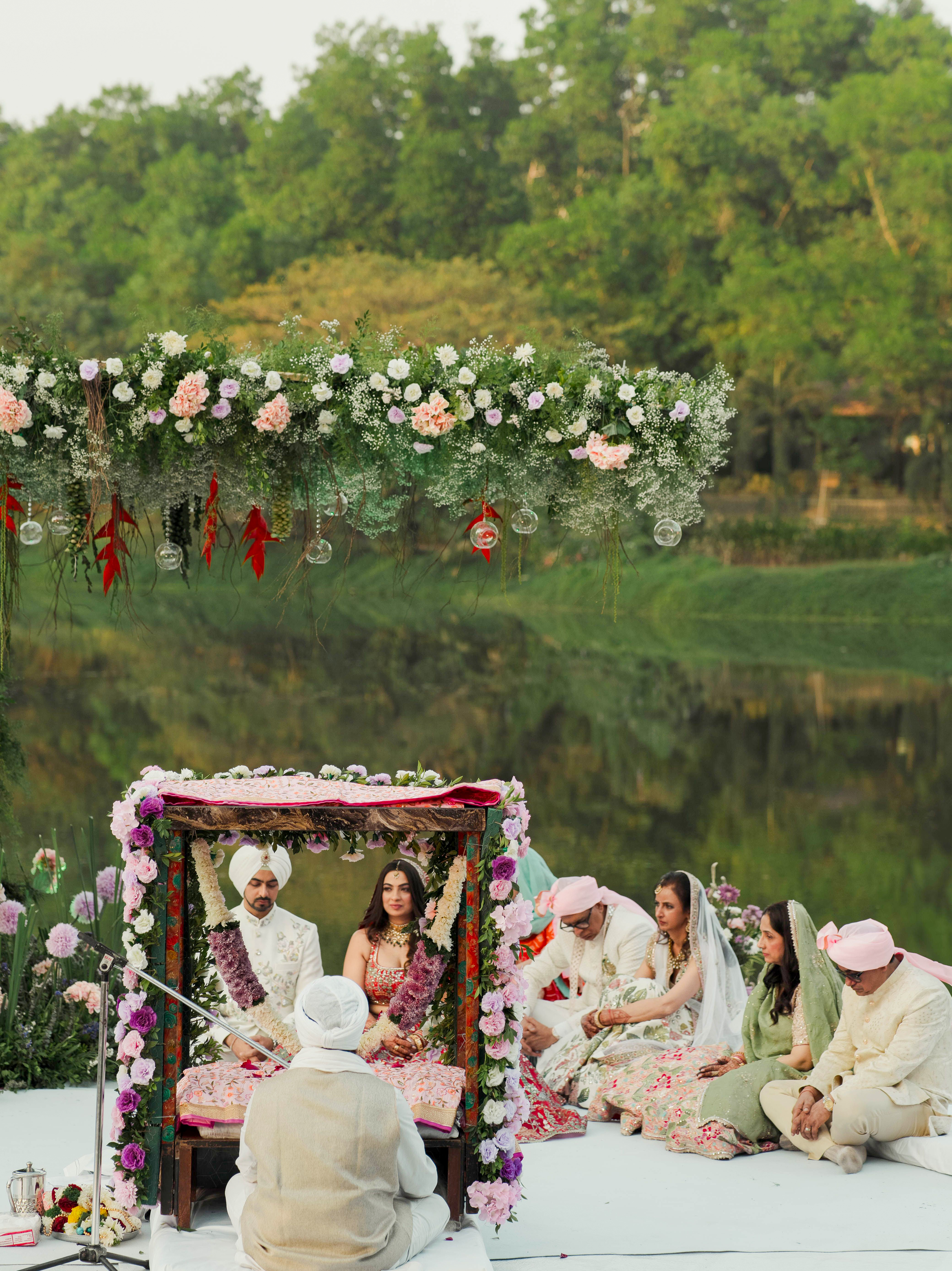 A serene outdoor wedding framed by nature, flowers and tradition. Image Courtesy: Uday Ahir, Pexels