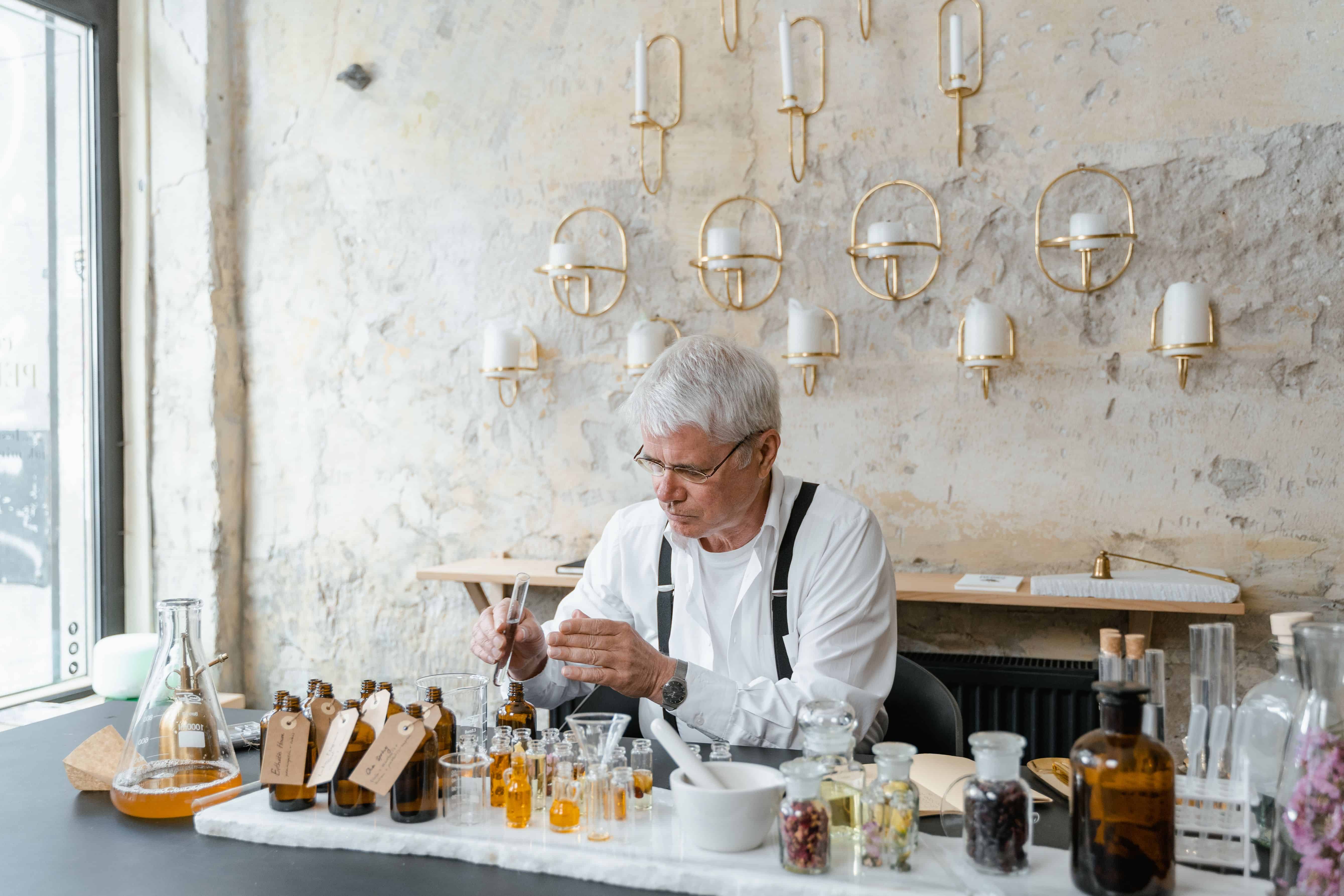 A perfumer at work, blending fragrant ingredients into a bespoke scent shaped by memory and occasion. Image Courtesy: MART PRODUCTION, Pexels