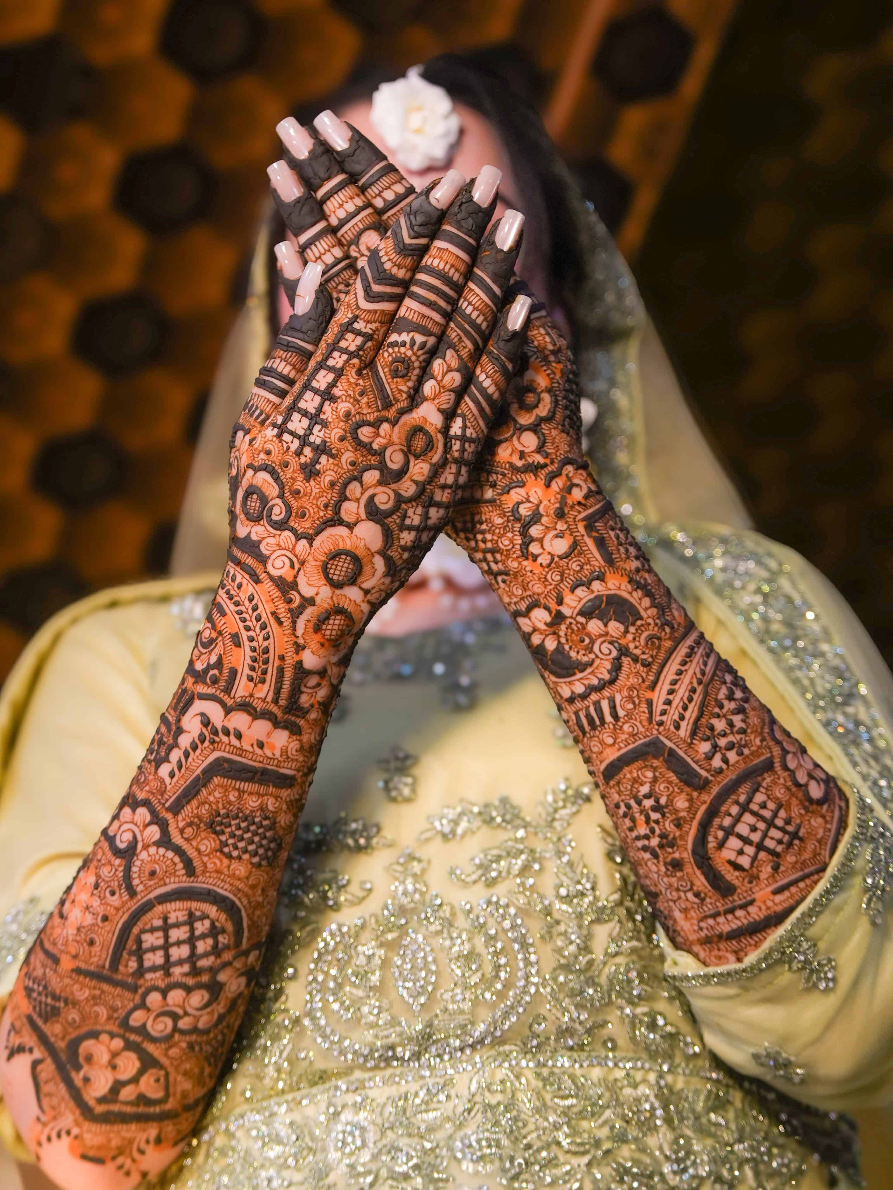 Intricate mehendi turns an age-old bridal ritual into a deeply personal expression of craft and ceremony. Image Courtesy: Bismah, Pexels
